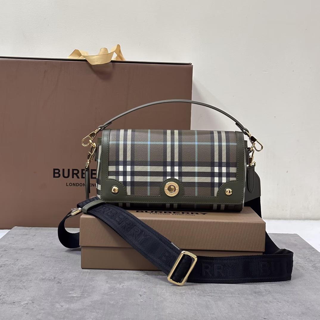 The P1080 Burberry women's slouchy backpack, inspired by the brand's archives, is crafted from canvas with a decorative Burberry check pattern and a logo engraved snap closure.24 x 8 x 14cmLeather top handle.Detachable and adjustable crossbody strap.1 internal slip pocket. Detachable and adjustable crossbody strap. 1 internal slip pocket. Top flap with magnetic snap closure. Hand-painted edges. Glossy metal