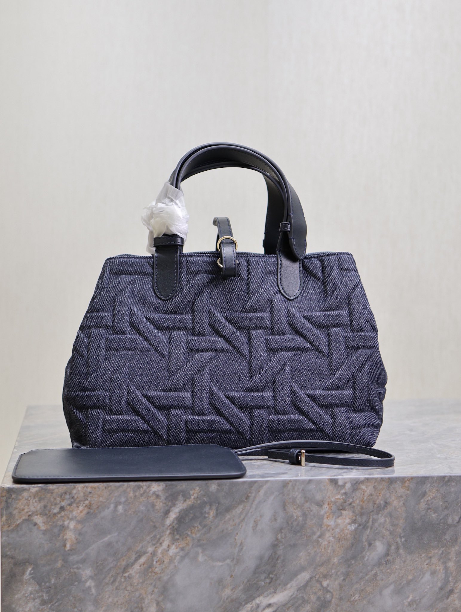 P1460 💯Medium Dior Toujours Handbag "Denim Rattan" This casual and functional Dior Toujours handbag is crafted from blue denim and other materials in a Graphic Rattan pattern and features a stylish 3D version of Dior's iconic pattern. Pockets to neatly organize everyday essentialsSlim leather lace closure to securely store itemsAdditional CD Lock with letter D knob closureAdjustable sides for added styleMedium sizeLeather top handle with adjustable detailsCan be carried on the hand or on the shoulderDouble closure: Slim lace and Christian Dior Paris lace with CD Lock closureD.I.O.R. Detachable charmInterior pouchAdjustable top leather handleModel No.: 1188Size: 28.5 x 21.5 x 17 cm (L x H x W)Holds 2 wallets, 1 cell phone, 2 card holders, sunglasses, and lipstick-High-quality imitation factory