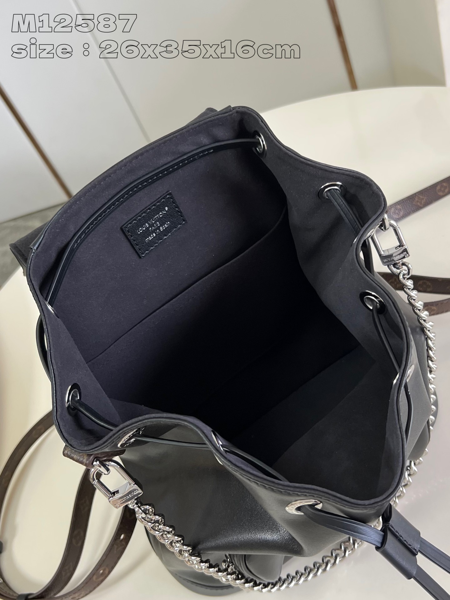 P1640 replica M12587 black This Montsouris small shoulder bag is made of shiny sheepskin leather with Monogram details that subtly tell the identity of the LV Vibe collectionLouis Vuitton's collection is rich in functionality with clasps and leather drawstringsChic metal pieces are the finishing touchA zippered front pocket keeps small items securely in place26.0 x 35.5 x 16.0 (L x H x W)