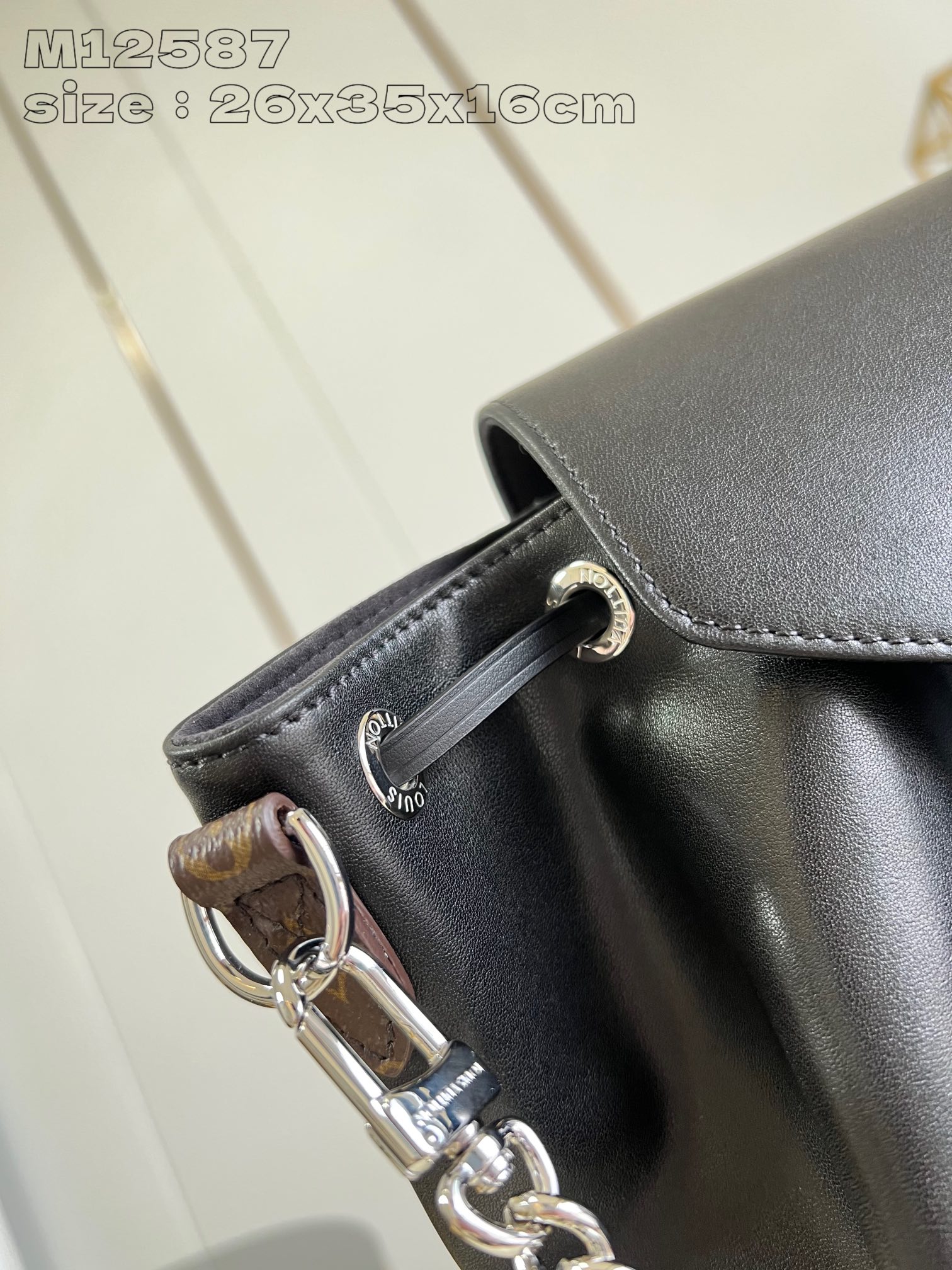 P1640 replica M12587 black This Montsouris small shoulder bag is made of shiny sheepskin leather with Monogram details that subtly tell the identity of the LV Vibe collectionLouis Vuitton's collection is rich in functionality with clasps and leather drawstringsChic metal pieces are the finishing touchA zippered front pocket keeps small items securely in place26.0 x 35.5 x 16.0 (L x H x W)