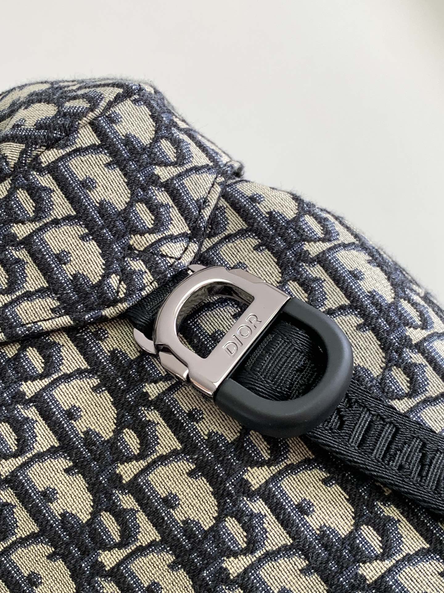P 1220The Dior 8 backpack is a new addition to the summer 2014 menswear collection with a flap design that pays homage to the fabulous outdoors and Dior's fashionable style.Crafted in beige and black Oblique printed fabricsThe main compartment has a flap with Dior 8 clasp to organize your daily essentialsFront zipper pocket and mesh fabric side pockets for easy access to your keys or earphonesPractical and versatile, it's the perfect addition to any look. Beige and black Oblique printInterior with Dior embossed logoPadded mesh fabricAdjustable shoulder strapLeather handlesRear side of bag with quilted tech-knit fabricReinforced with Dior logoFlap closure with 2 Dior 8 claspsFront zipped pocketSides with 2 mesh fabric side pocketsInterior zipped pocket with dust pocketNo. 1 EIBA187YKK 1EIBA187YKY_H27E1213Size: 31 x 50 x 18 cm-High-Fashion Factory
