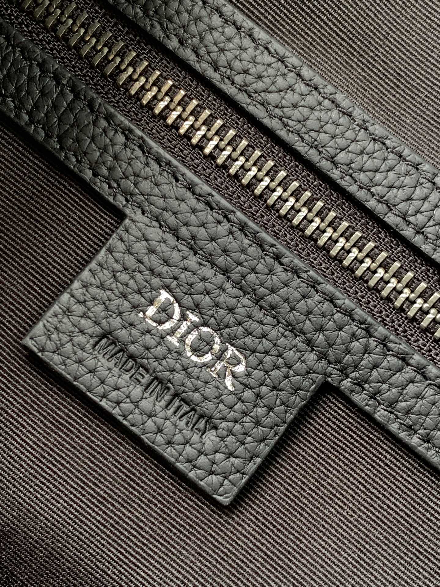 P 1220The Dior 8 backpack is a new addition to the summer 2014 menswear collection with a flap design that pays homage to the fabulous outdoors and Dior's fashionable style.Crafted in beige and black Oblique printed fabricsThe main compartment has a flap with Dior 8 clasp to organize your daily essentialsFront zipper pocket and mesh fabric side pockets for easy access to your keys or earphonesPractical and versatile, it's the perfect addition to any look. Beige and black Oblique printInterior with Dior embossed logoPadded mesh fabricAdjustable shoulder strapLeather handlesRear side of bag with quilted tech-knit fabricReinforced with Dior logoFlap closure with 2 Dior 8 claspsFront zipped pocketSides with 2 mesh fabric side pocketsInterior zipped pocket with dust pocketNo. 1 EIBA187YKK 1EIBA187YKY_H27E1213Size: 31 x 50 x 18 cm-High-Fashion Factory