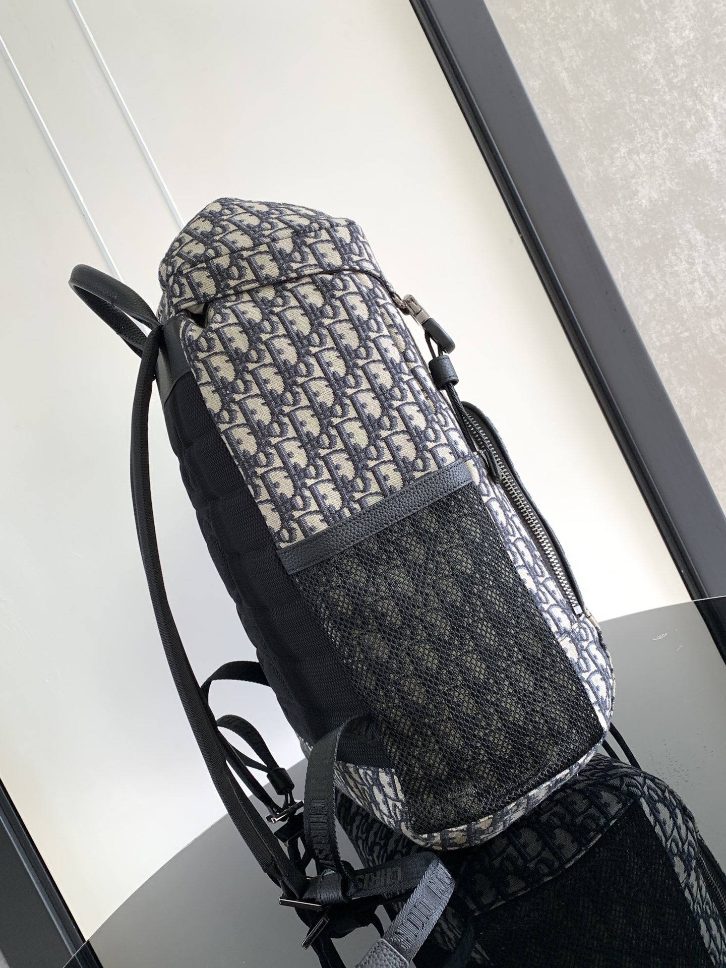 P 1220The Dior 8 backpack is a new addition to the summer 2014 menswear collection with a flap design that pays homage to the fabulous outdoors and Dior's fashionable style.Crafted in beige and black Oblique printed fabricsThe main compartment has a flap with Dior 8 clasp to organize your daily essentialsFront zipper pocket and mesh fabric side pockets for easy access to your keys or earphonesPractical and versatile, it's the perfect addition to any look. Beige and black Oblique printInterior with Dior embossed logoPadded mesh fabricAdjustable shoulder strapLeather handlesRear side of bag with quilted tech-knit fabricReinforced with Dior logoFlap closure with 2 Dior 8 claspsFront zipped pocketSides with 2 mesh fabric side pocketsInterior zipped pocket with dust pocketNo. 1 EIBA187YKK 1EIBA187YKY_H27E1213Size: 31 x 50 x 18 cm-High-Fashion Factory
