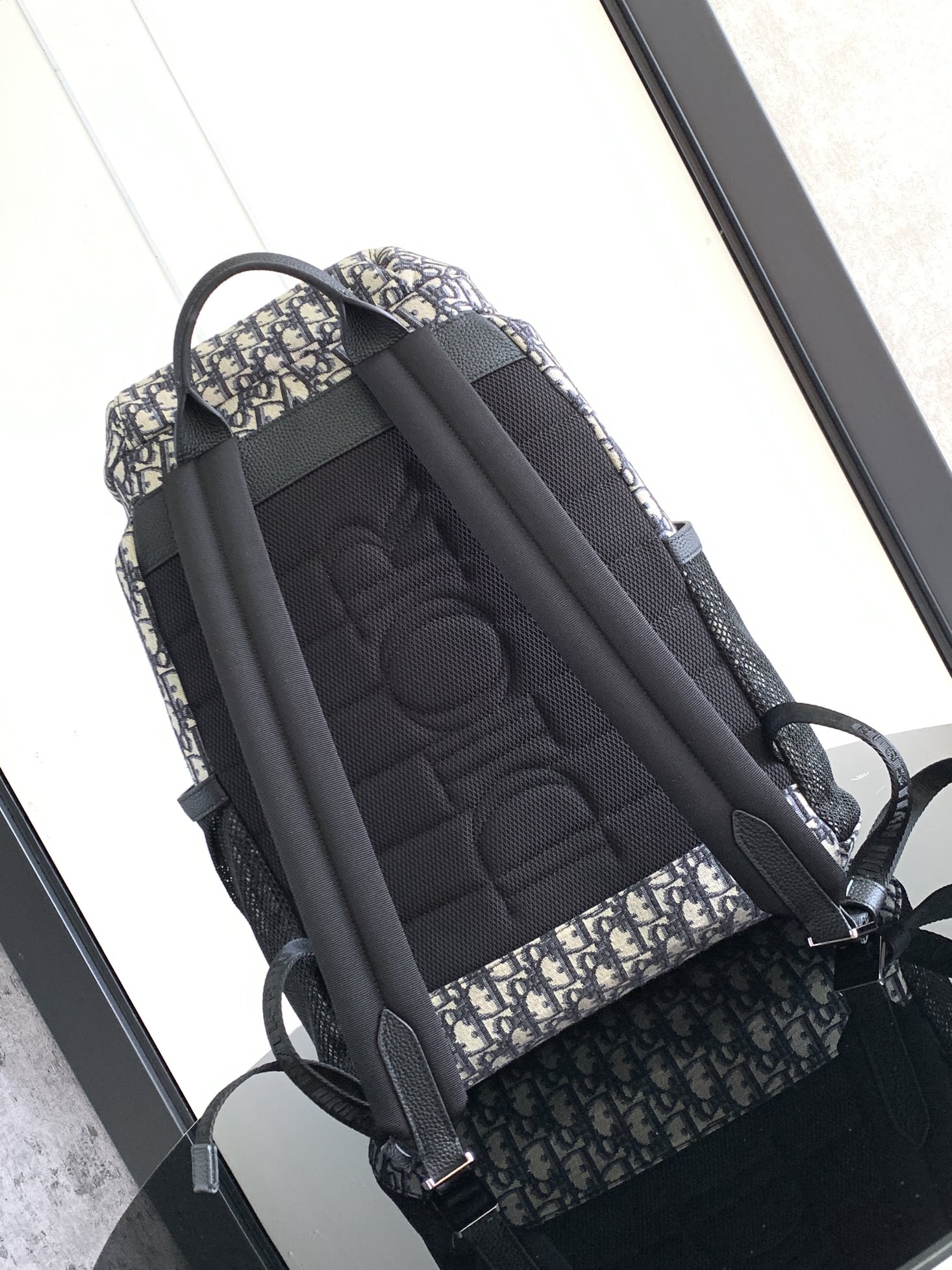 P 1220The Dior 8 backpack is a new addition to the summer 2014 menswear collection with a flap design that pays homage to the fabulous outdoors and Dior's fashionable style.Crafted in beige and black Oblique printed fabricsThe main compartment has a flap with Dior 8 clasp to organize your daily essentialsFront zipper pocket and mesh fabric side pockets for easy access to your keys or earphonesPractical and versatile, it's the perfect addition to any look. Beige and black Oblique printInterior with Dior embossed logoPadded mesh fabricAdjustable shoulder strapLeather handlesRear side of bag with quilted tech-knit fabricReinforced with Dior logoFlap closure with 2 Dior 8 claspsFront zipped pocketSides with 2 mesh fabric side pocketsInterior zipped pocket with dust pocketNo. 1 EIBA187YKK 1EIBA187YKY_H27E1213Size: 31 x 50 x 18 cm-High-Fashion Factory