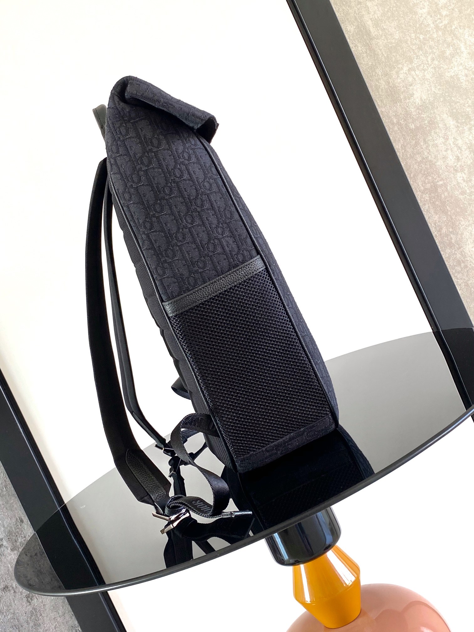 The Dior 8 roll-top backpack, a new addition to the Spring 2025 menswear collection, is stylish and functional, crafted from materials such as black Oblique printed fabric and enhanced with a self-buckle flap with Dior 8 buckle. The front, adorned with the Dior logo, features a spacious main compartment, two slash pockets, and two mesh fabric side pockets for practical use and to add the finishing touch to a casual look Body: cotton Technical fabricBull leatherLining: CottonTechnical fabricBull leather main compartment with self-fastening flap and Dior 8 buckleInterior flat computer compartmentInterior slit pocketsSide mesh fabric pocketsLeather top handlesAdjustable padded shoulder strapPadded mesh fabric backDior logo on frontMetal overlayBrass Dior logo on frontDior logo embossed on interiorInterior Dior embossingPackage with dust bagSize: 39 x 42 x 13 cm (L x H x W) 13 cm (L x H x W)Main compartment for 1 15-inch laptop, A4 documents and 1 tabletSide pockets for various cell phone modelsNo. 1ESBA216YK-High-Fashion Factory