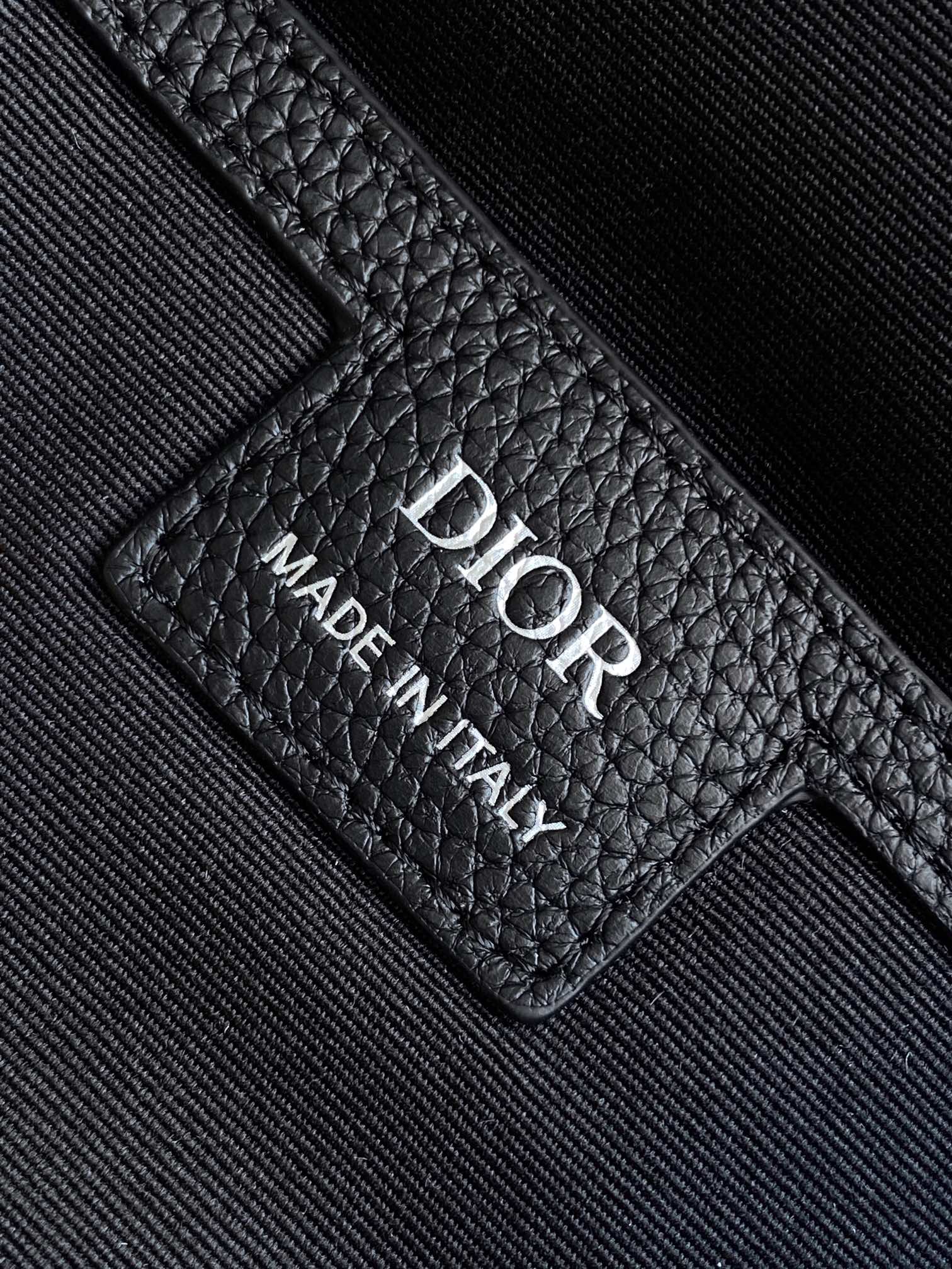 The Dior 8 roll-top backpack, a new addition to the Spring 2025 menswear collection, is stylish and functional, crafted from materials such as black Oblique printed fabric and enhanced with a self-buckle flap with Dior 8 buckle. The front, adorned with the Dior logo, features a spacious main compartment, two slash pockets, and two mesh fabric side pockets for practical use and to add the finishing touch to a casual look Body: cotton Technical fabricBull leatherLining: CottonTechnical fabricBull leather main compartment with self-fastening flap and Dior 8 buckleInterior flat computer compartmentInterior slit pocketsSide mesh fabric pocketsLeather top handlesAdjustable padded shoulder strapPadded mesh fabric backDior logo on frontMetal overlayBrass Dior logo on frontDior logo embossed on interiorInterior Dior embossingPackage with dust bagSize: 39 x 42 x 13 cm (L x H x W) 13 cm (L x H x W)Main compartment for 1 15-inch laptop, A4 documents and 1 tabletSide pockets for various cell phone modelsNo. 1ESBA216YK-High-Fashion Factory