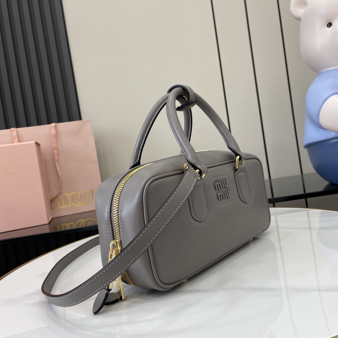 Image[2]-p1720 miumiu miu miu Arcadie Cowhide Medium (27cm) Bowling Tote/Crossbody ~ Cognac Cowhide This Arcadic handbag highlights the unique concept that fashion is a reflection of reality translated into material form with a metallic hardware finish that mirrors the monogrammed logo in a sophisticated finish for a recognizable classic style. Dynamic and elegant lines with adjustable and removable shoulder strap presents a practical and versatile design with modern appealDetachable and adjustable shoulder strap with zipper closurePainted metal letter logo on front with lining and zipper pocket with studsModel No.: 5BB148Dimensions: 27 (L) x 12 (W) x 9cm (Thick)Color: Grey/-High-quality bags