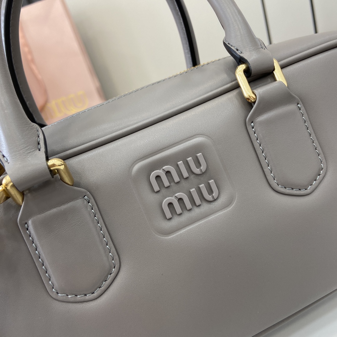 Image[7]-p1720 miumiu miu miu Arcadie Cowhide Medium (27cm) Bowling Tote/Crossbody ~ Cognac Cowhide This Arcadic handbag highlights the unique concept that fashion is a reflection of reality translated into material form with a metallic hardware finish that mirrors the monogrammed logo in a sophisticated finish for a recognizable classic style. Dynamic and elegant lines with adjustable and removable shoulder strap presents a practical and versatile design with modern appealDetachable and adjustable shoulder strap with zipper closurePainted metal letter logo on front with lining and zipper pocket with studsModel No.: 5BB148Dimensions: 27 (L) x 12 (W) x 9cm (Thick)Color: Grey/-High-quality bags
