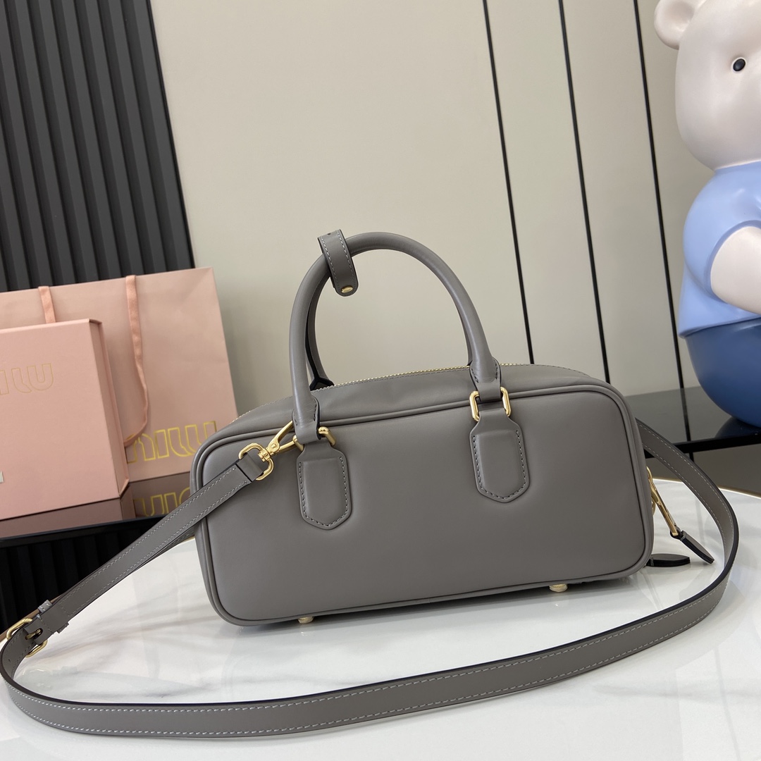 Image[3]-p1720 miumiu miu miu Arcadie Cowhide Medium (27cm) Bowling Tote/Crossbody ~ Cognac Cowhide This Arcadic handbag highlights the unique concept that fashion is a reflection of reality translated into material form with a metallic hardware finish that mirrors the monogrammed logo in a sophisticated finish for a recognizable classic style. Dynamic and elegant lines with adjustable and removable shoulder strap presents a practical and versatile design with modern appealDetachable and adjustable shoulder strap with zipper closurePainted metal letter logo on front with lining and zipper pocket with studsModel No.: 5BB148Dimensions: 27 (L) x 12 (W) x 9cm (Thick)Color: Grey/-High-quality bags
