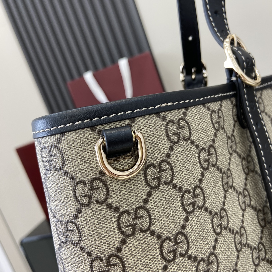 p1040🎁🎁 GG Emblem Large Tote BagThe new GG Emblem collection is a fresh interpretation of the brand's timeless elegance and craftsmanshipThis large tote bag with adjustable handle is adorned with counting eyelets inspired by the equestrian worldBeige and dark brownNew GG monogram-coated textileBrown leather pipingContrasting stitchingRed and green webbingCotton liningAdditional D-ring for detachable itemsDecimalized eyeletsAdjustable handles (height 21-31 cm)Interior: 2 compartments and 1 central zipped compartmentMagnetic closureWeight: 2.5 kg - 31 cm) Interior: 2 compartments and 1 central zippered compartment Magnetic snap closure Weight: approx. 1.2 kgHolds iPhone Pro Max/Plus, Airpods headphones, long wallet and lipstickModel No.: 815212Size: 45.5 (W) x 30 (H) x 16cm (D)Color: Brown Gum Gram Color/Italian Creation