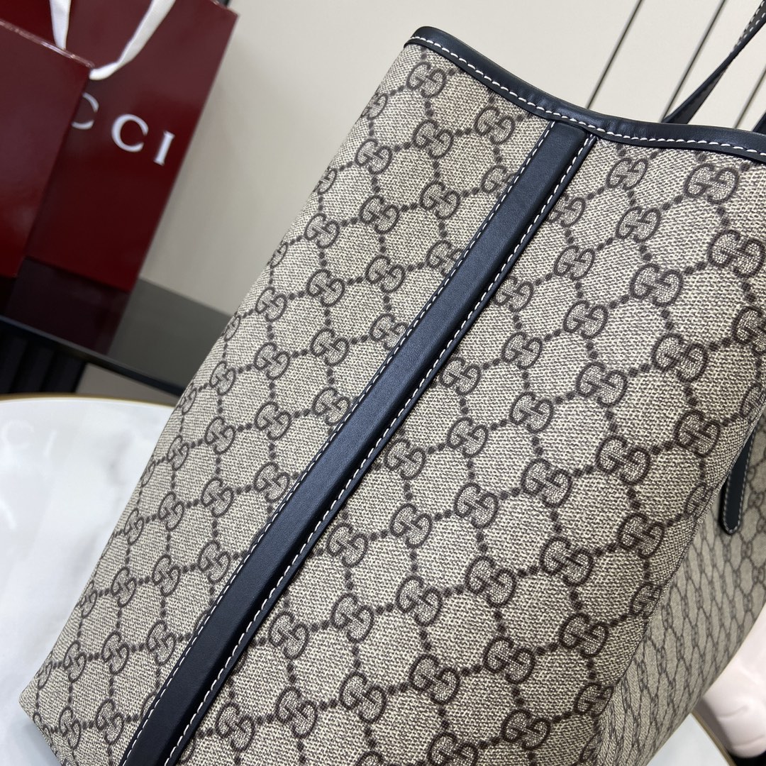 p1040🎁🎁 GG Emblem Large Tote BagThe new GG Emblem collection is a fresh interpretation of the brand's timeless elegance and craftsmanshipThis large tote bag with adjustable handle is adorned with counting eyelets inspired by the equestrian worldBeige and dark brownNew GG monogram-coated textileBrown leather pipingContrasting stitchingRed and green webbingCotton liningAdditional D-ring for detachable itemsDecimalized eyeletsAdjustable handles (height 21-31 cm)Interior: 2 compartments and 1 central zipped compartmentMagnetic closureWeight: 2.5 kg - 31 cm) Interior: 2 compartments and 1 central zippered compartment Magnetic snap closure Weight: approx. 1.2 kgHolds iPhone Pro Max/Plus, Airpods headphones, long wallet and lipstickModel No.: 815212Size: 45.5 (W) x 30 (H) x 16cm (D)Color: Brown Gum Gram Color/Italian Creation