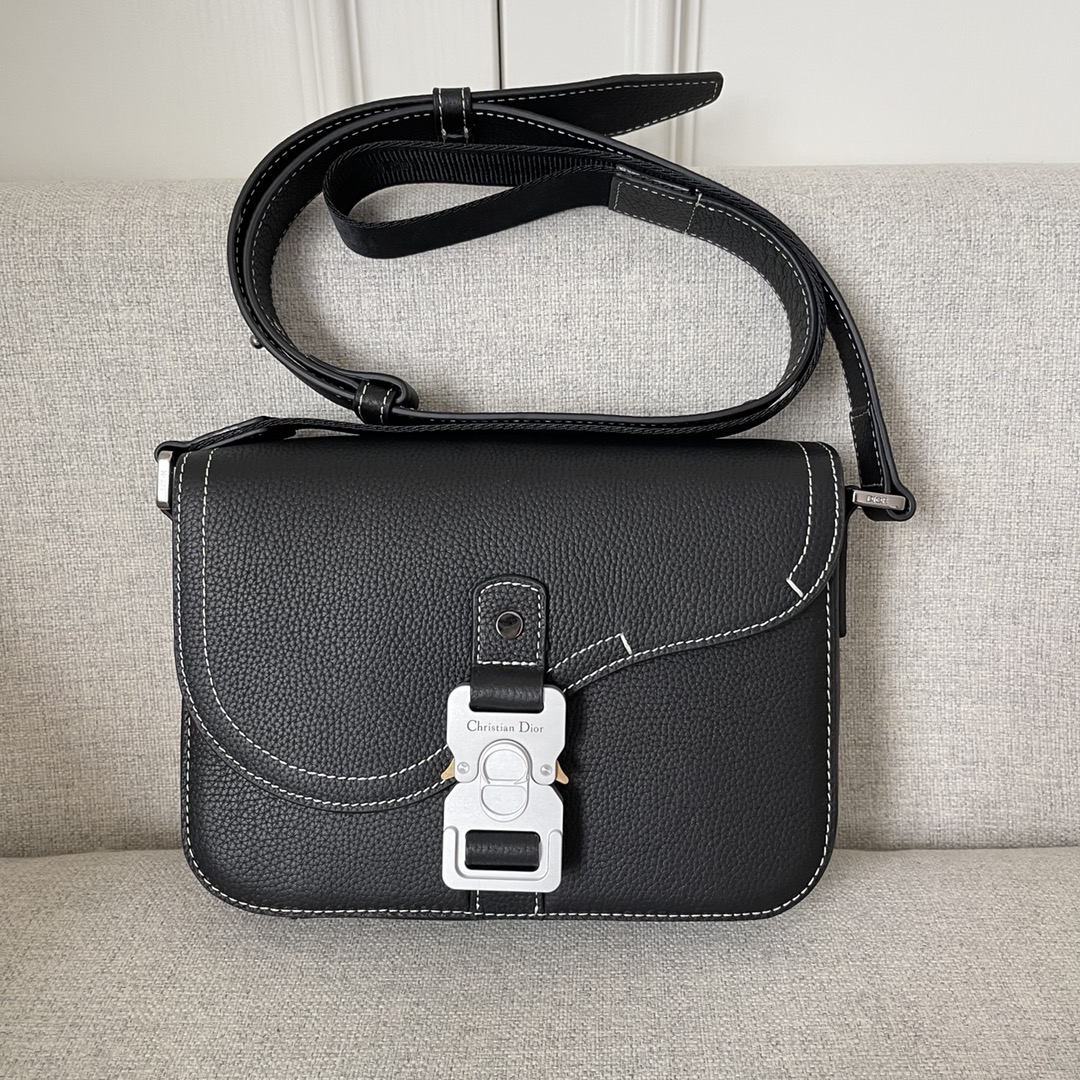 Image [1]-This saddle bag with shoulder strap is the season's smartest and most stylish crafted in black grained cowhide leather with contrasting stitching and a saddle-inspired flap embellished with an aluminum clasp for a touch of styleMiniature style with a spacious interior and a patch pocket for added sophisticationCan be worn on the shoulder or cross-body with an adjustable leather and Christian Dior jacquard shoulder strap Model. D8016Size 23-18-6Black grained cowhide with contrasting stitchingDior logo embossed on the insideAdjustable leather and nylon Christian Dior logo jacquard shoulder strapFlap closureAluminum buckle with Christian Dior logo and CD initialsInterior patch pocketInterior patch pocket with dust bagMade in Italy191701100-High-quality bags