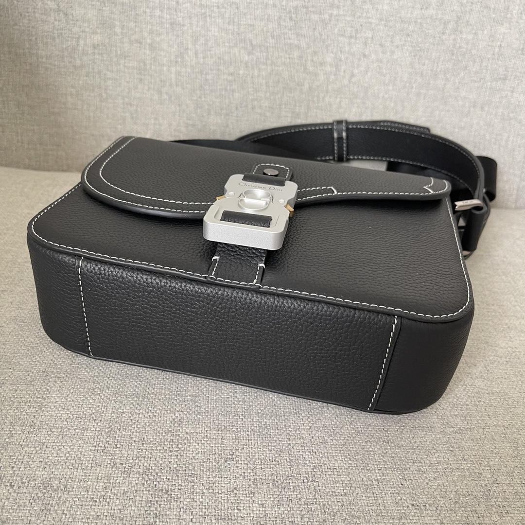 Image [4]-This saddle bag with shoulder strap is the season's smartest and most stylish crafted in black grained cowhide leather with contrasting stitching and a saddle-inspired flap embellished with an aluminum clasp for a touch of styleMiniature style with a spacious interior and a patch pocket for added sophisticationCan be worn on the shoulder or cross-body with an adjustable leather and Christian Dior jacquard shoulder strap Model. D8016Size 23-18-6Black grained cowhide with contrasting stitchingDior embossed logo on insideAdjustable leather and nylon Christian Dior logo jacquard shoulder strapFlap closureAluminum buckle embellished with the Christian Dior logo and the initials CDInterior patch pocketInterior patch pocket with dust bagMade in Italy191701100-High-quality bags