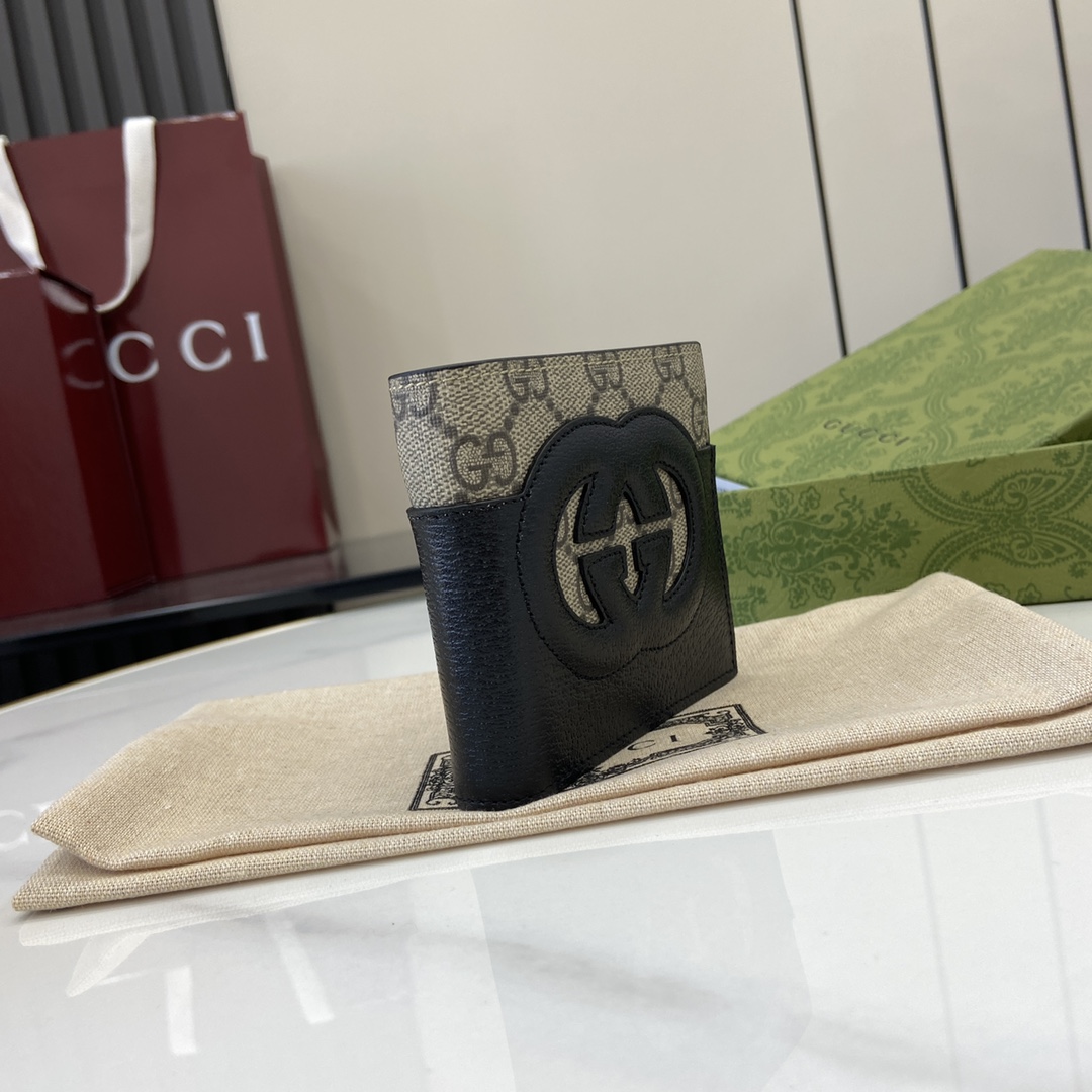 p380 The Gucci Interlocking Double G Wallet has been an integral part of Gucci's collections since its inception in the 1960s. The logo, derived from the initials of the House's founder, Mr. Guccio Gucci, continues to be reinvented in a variety of forms and styles, and in this leather and GG Supreme canvas wallet it is presented with openwork details that create a contemporary and classic look with accessories in black and brown GG Supreme canvas, black leather piping and cloud fabric lining. This wallet in leather and GG Supreme canvas features cut-out details to create a modern and classic accessory Black and brown GG Supreme canvas Black leather piping Cloud fabric lining Interlocking double G cut-out details Interior: 8 card compartments 2 bill compartmentsModel Number: 701420Dimensions when closed: 11 (W) x 9cm (H)Size when open: 21 (W) x 9cm (H)Color: black leather/pvcItalian Creation