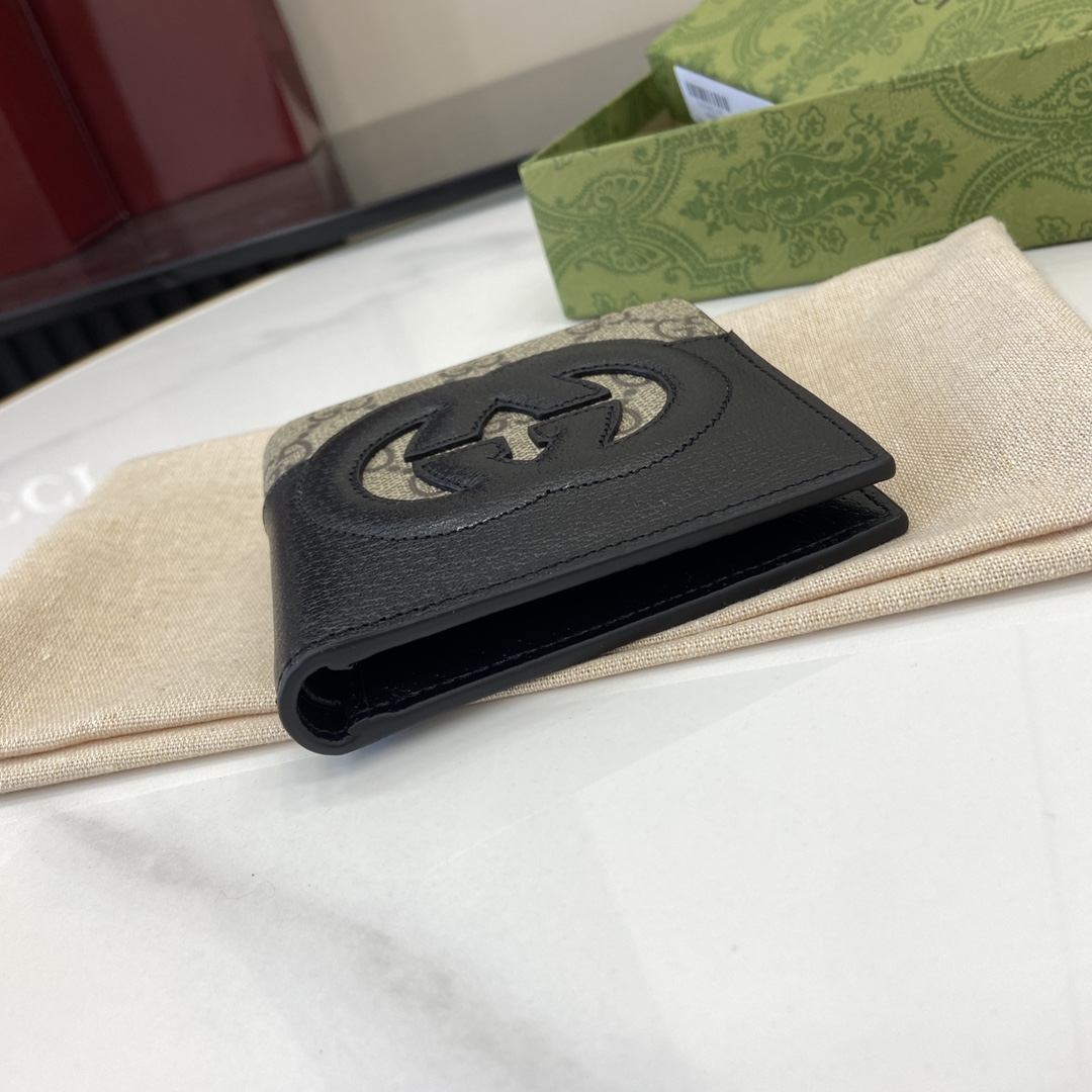 p380 The Gucci Interlocking Double G Wallet has been an integral part of Gucci's collections since its inception in the 1960s. The logo, derived from the initials of the House's founder, Mr. Guccio Gucci, continues to be reinvented in a variety of forms and styles, and in this leather and GG Supreme canvas wallet it is presented with openwork details that create a contemporary and classic look with accessories in black and brown GG Supreme canvas, black leather piping and cloud fabric lining. This wallet in leather and GG Supreme canvas features cut-out details to create a modern and classic accessory Black and brown GG Supreme canvas Black leather piping Cloud fabric lining Interlocking double G cut-out details Interior: 8 card compartments 2 bill compartmentsModel Number: 701420Dimensions when closed: 11 (W) x 9cm (H)Size when open: 21 (W) x 9cm (H)Color: black leather/pvcItalian Creation