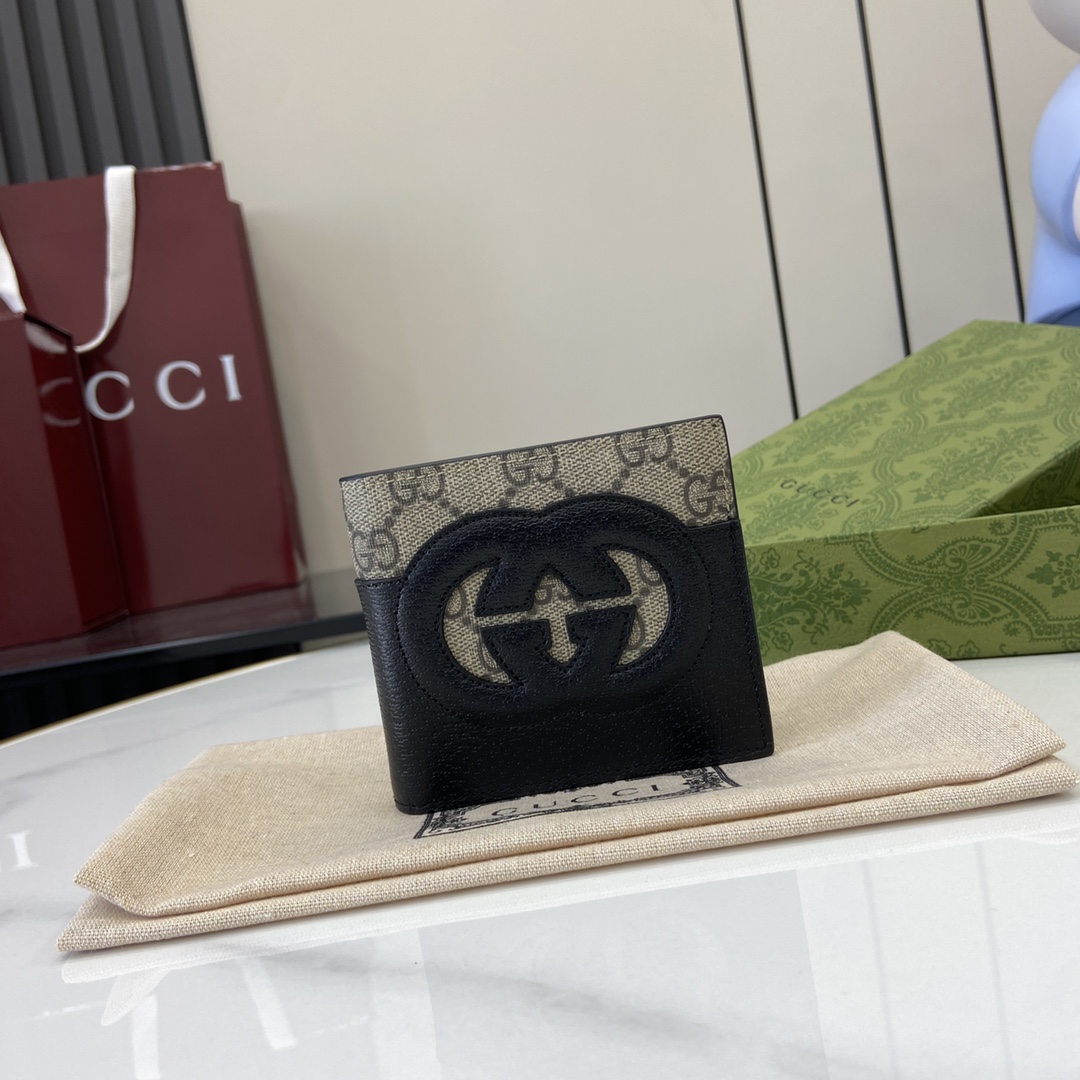 p380 The Gucci Interlocking Double G Wallet has been an integral part of Gucci's collections since its inception in the 1960s. The logo, derived from the initials of the House's founder, Mr. Guccio Gucci, continues to be reinvented in a variety of forms and styles, and in this leather and GG Supreme canvas wallet it is presented with openwork details that create a contemporary and classic look with accessories in black and brown GG Supreme canvas, black leather piping and cloud fabric lining. This wallet in leather and GG Supreme canvas features cut-out details to create a modern and classic accessory Black and brown GG Supreme canvas Black leather piping Cloud fabric lining Interlocking double G cut-out details Interior: 8 card compartments 2 bill compartmentsModel Number: 701420Dimensions when closed: 11 (W) x 9cm (H)Size when open: 21 (W) x 9cm (H)Color: black leather/pvcItalian Creation