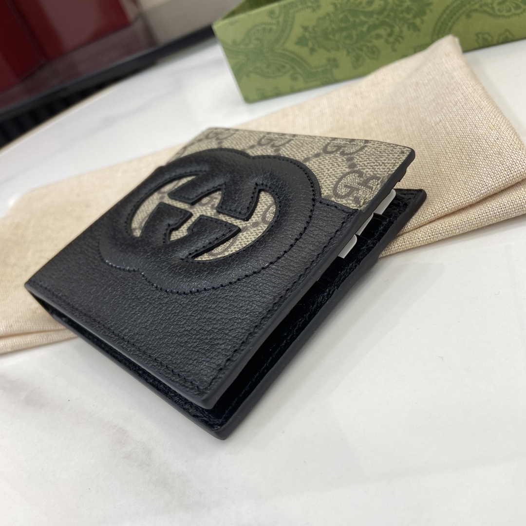 p380 The Gucci Interlocking Double G Wallet has been an integral part of Gucci's collections since its inception in the 1960s. The logo, derived from the initials of the House's founder, Mr. Guccio Gucci, continues to be reinvented in a variety of forms and styles, and in this leather and GG Supreme canvas wallet it is presented with openwork details that create a contemporary and classic look with accessories in black and brown GG Supreme canvas, black leather piping and cloud fabric lining. This wallet in leather and GG Supreme canvas features cut-out details to create a modern and classic accessory Black and brown GG Supreme canvas Black leather piping Cloud fabric lining Interlocking double G cut-out details Interior: 8 card compartments 2 bill compartmentsModel Number: 701420Dimensions when closed: 11 (W) x 9cm (H)Size when open: 21 (W) x 9cm (H)Color: black leather/pvcItalian Creation