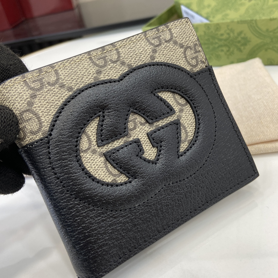 p380 The Gucci Interlocking Double G Wallet has been an integral part of Gucci's collections since its inception in the 1960s. The logo, derived from the initials of the House's founder, Mr. Guccio Gucci, continues to be reinvented in a variety of forms and styles, and in this leather and GG Supreme canvas wallet it is presented with openwork details that create a contemporary and classic look with accessories in black and brown GG Supreme canvas, black leather piping and cloud fabric lining. This wallet in leather and GG Supreme canvas features cut-out details to create a modern and classic accessory Black and brown GG Supreme canvas Black leather piping Cloud fabric lining Interlocking double G cut-out details Interior: 8 card compartments 2 bill compartmentsModel Number: 701420Dimensions when closed: 11 (W) x 9cm (H)Size when open: 21 (W) x 9cm (H)Color: black leather/pvcItalian Creation