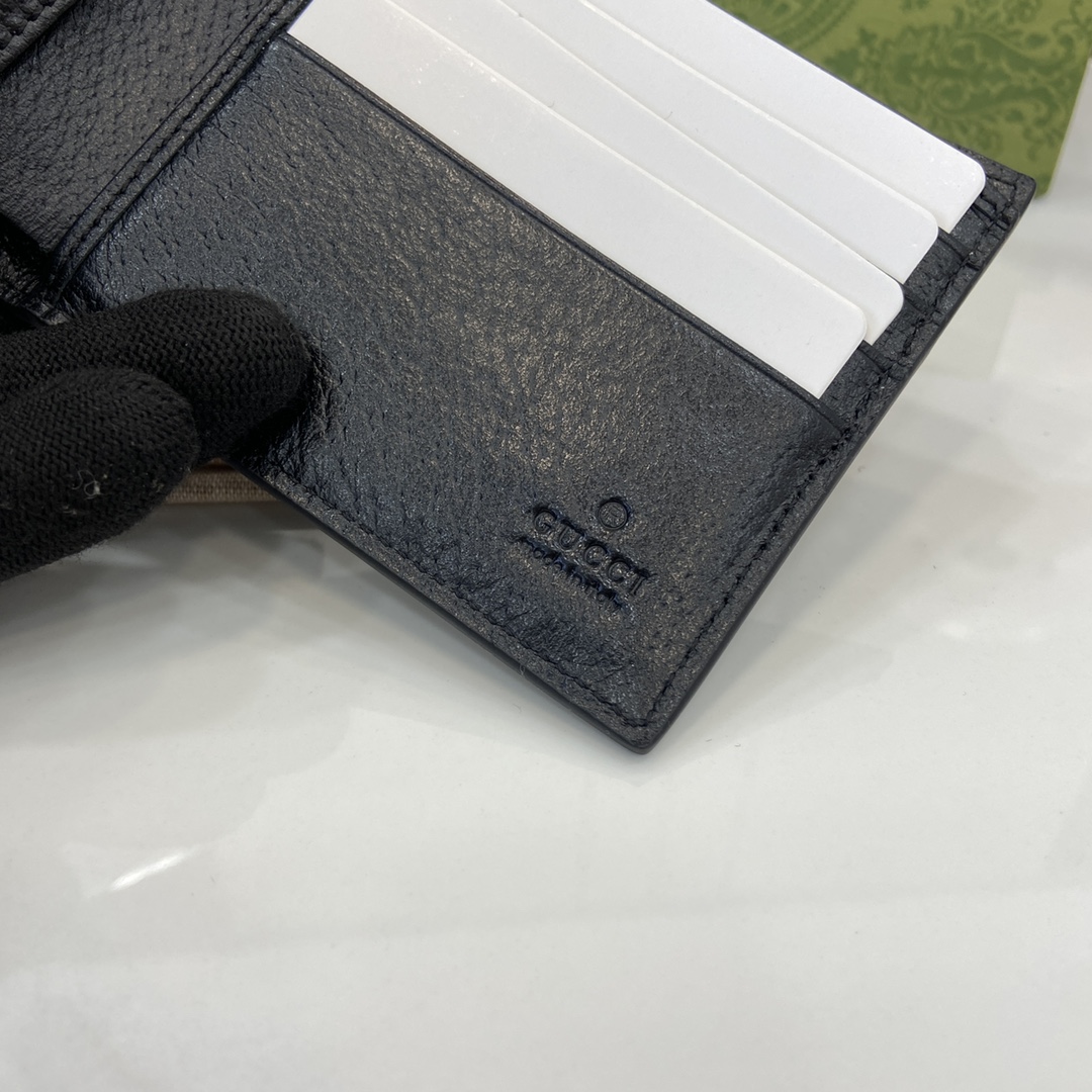 p380 The Gucci Interlocking Double G Wallet has been an integral part of Gucci's collections since its inception in the 1960s. The logo, derived from the initials of the House's founder, Mr. Guccio Gucci, continues to be reinvented in a variety of forms and styles, and in this leather and GG Supreme canvas wallet it is presented with openwork details that create a contemporary and classic look with accessories in black and brown GG Supreme canvas, black leather piping and cloud fabric lining. This wallet in leather and GG Supreme canvas features cut-out details to create a modern and classic accessory Black and brown GG Supreme canvas Black leather piping Cloud fabric lining Interlocking double G cut-out details Interior: 8 card compartments 2 bill compartmentsModel Number: 701420Dimensions when closed: 11 (W) x 9cm (H)Size when open: 21 (W) x 9cm (H)Color: black leather/pvcItalian Creation